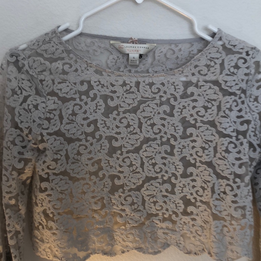 a Runway collection,crop top with belled sleeves